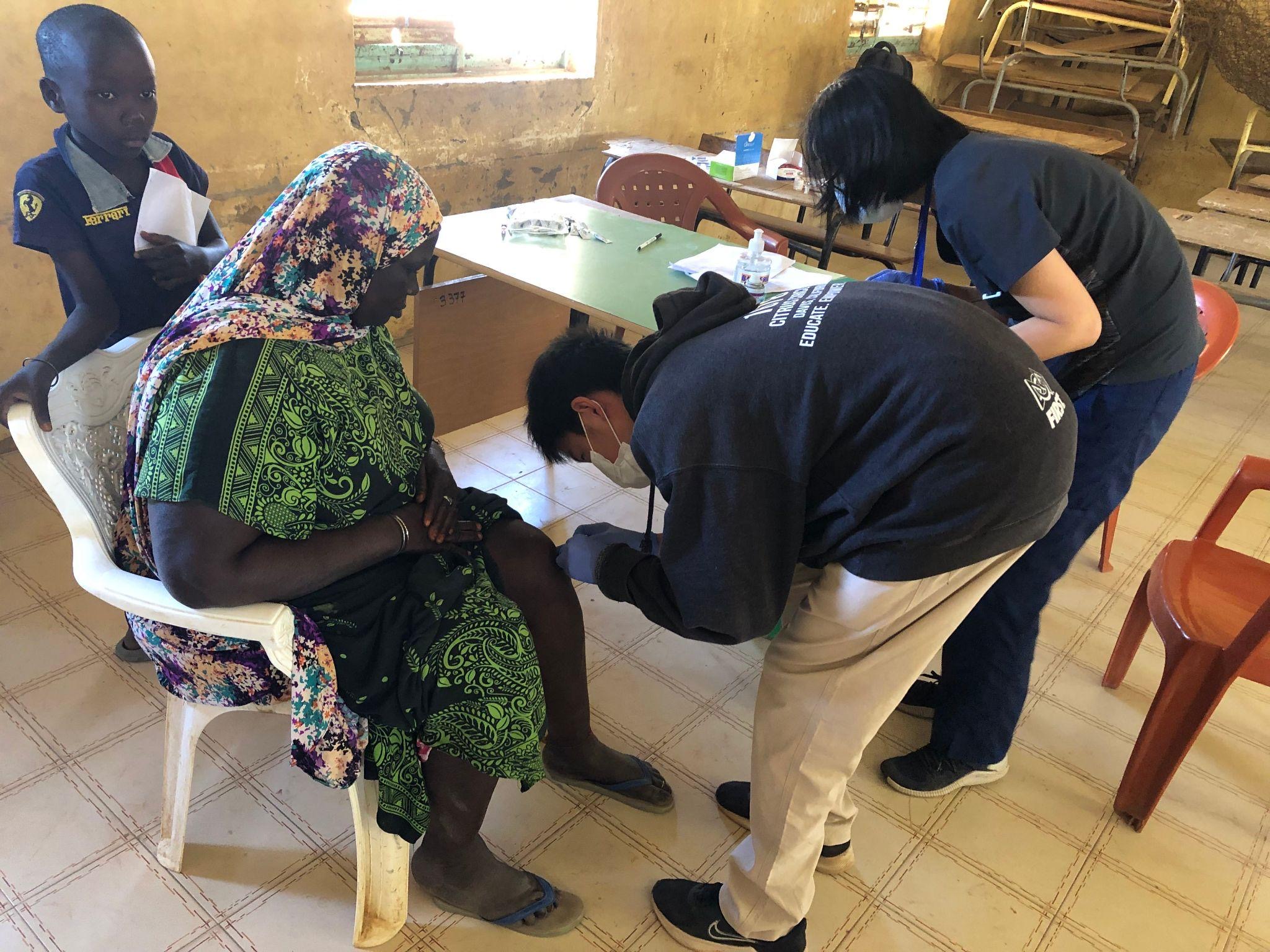 Me assisting my mom in the treatment of patients